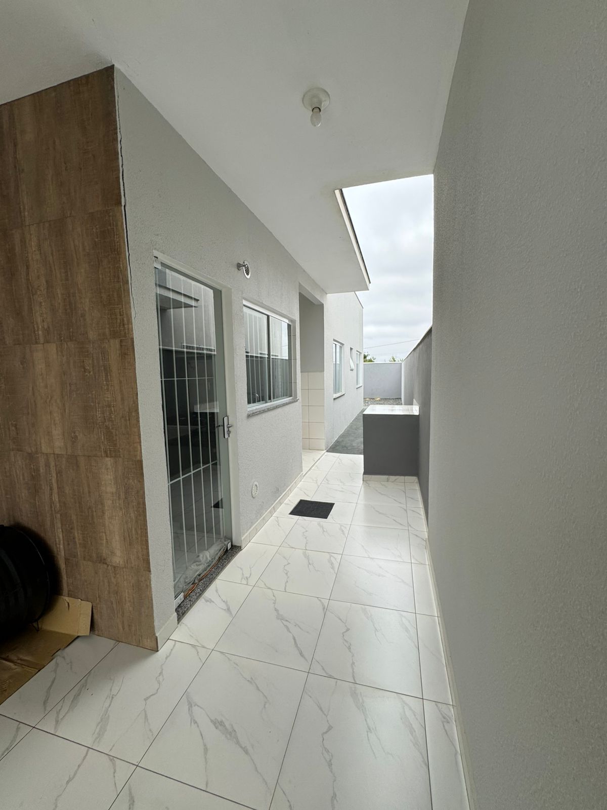 Casa geminada com amplo terreno em Itajuba
